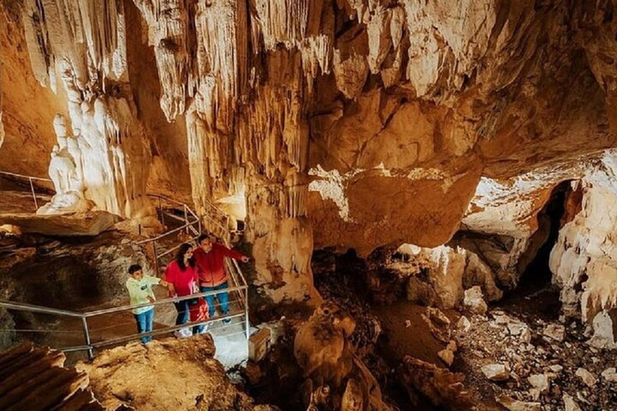 a group of people standing inside of a cave