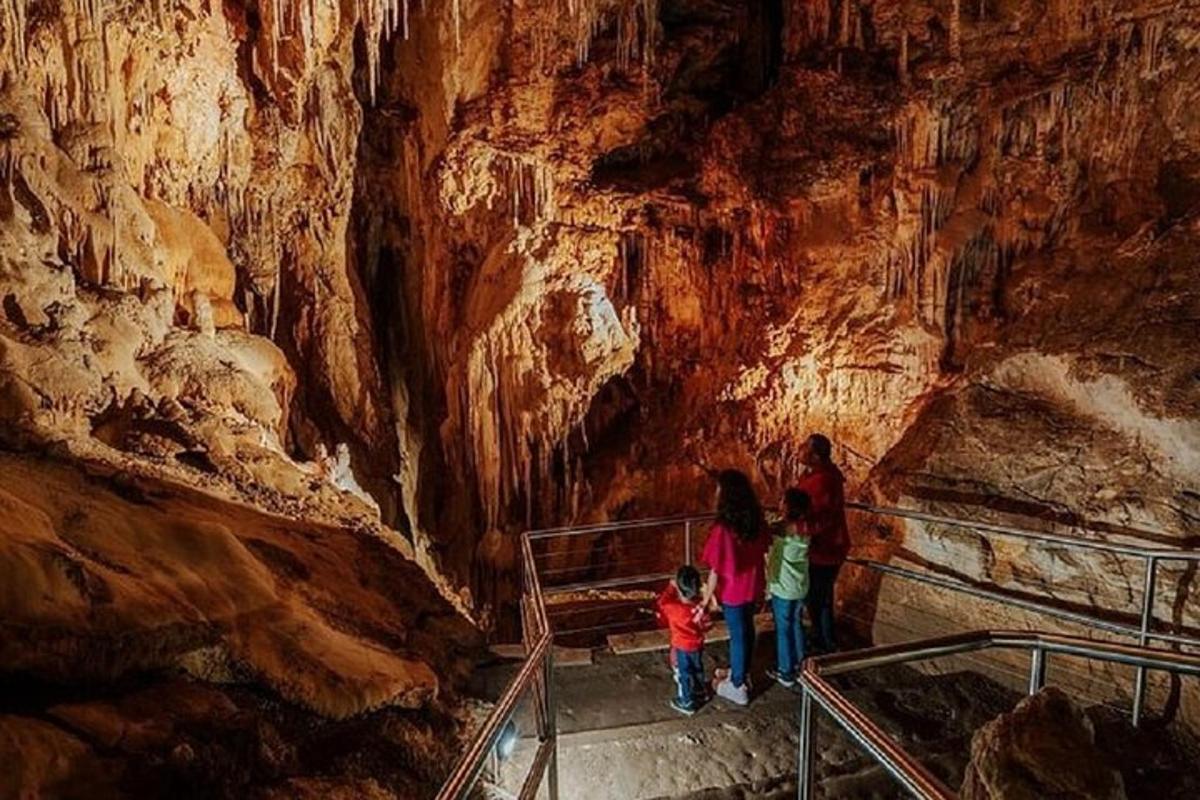 a group of people standing in a cave