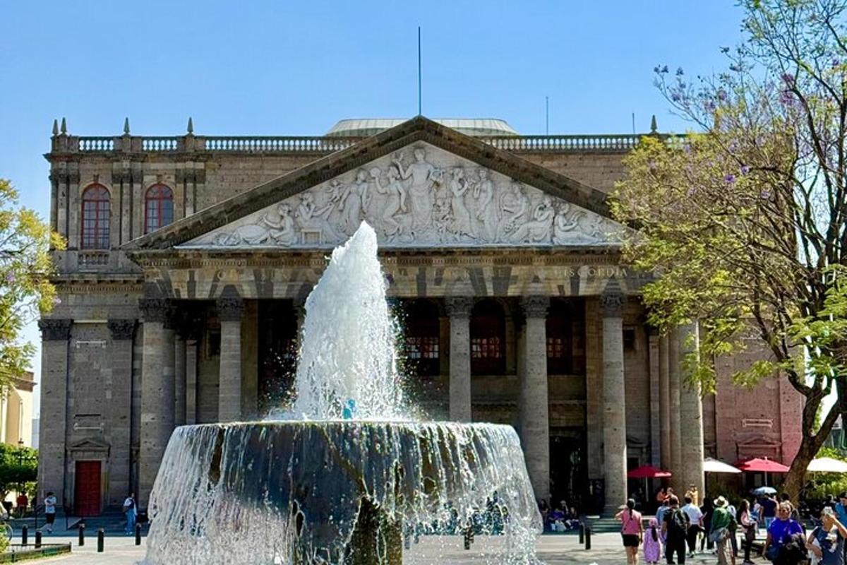a fountain in front of a building with a building