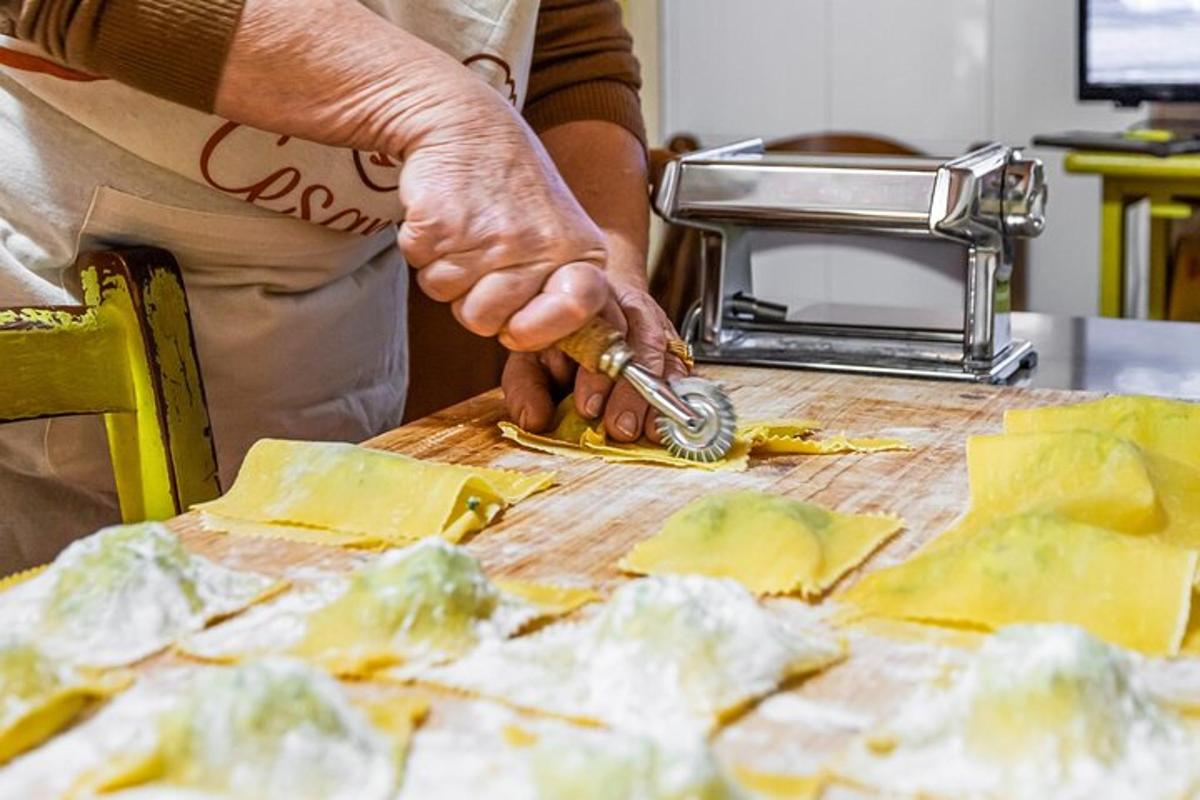 a person cutting cheese on a cutting board