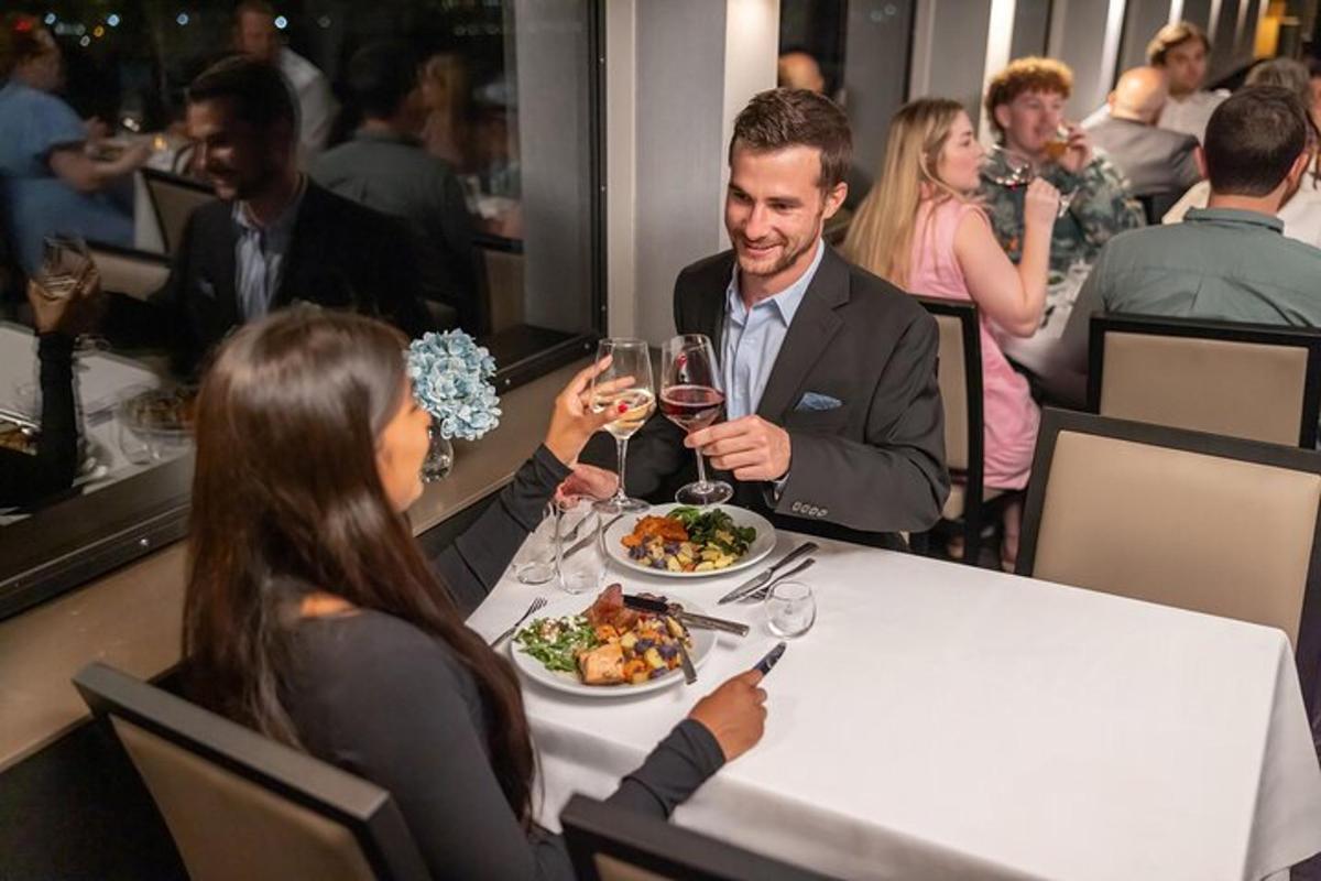 a group of people sitting at a table with wine glasses