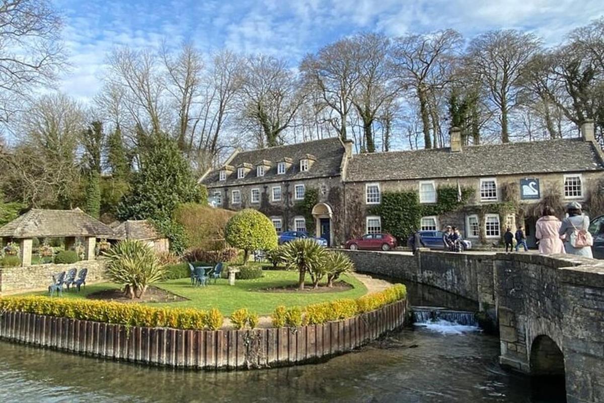 a building next to a river with a bridge