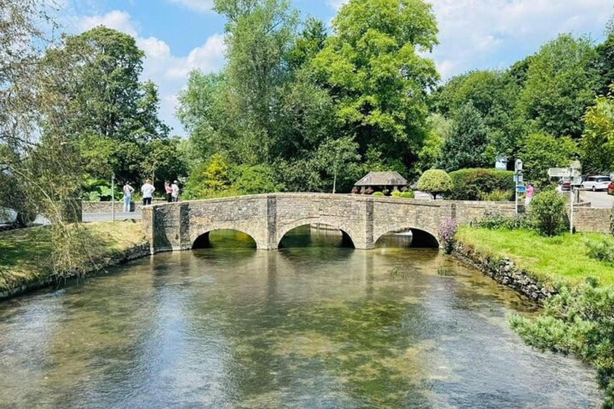 a bridge over a river with people walking on it