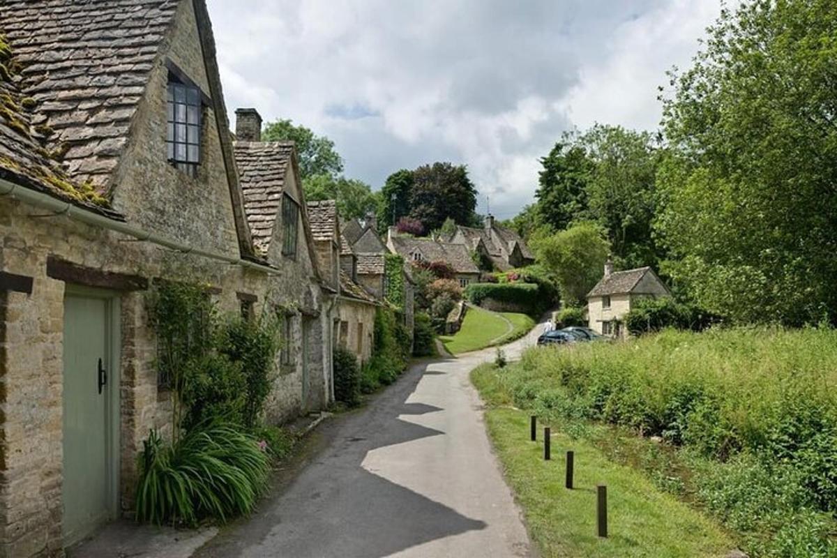 a winding street in a small village with houses
