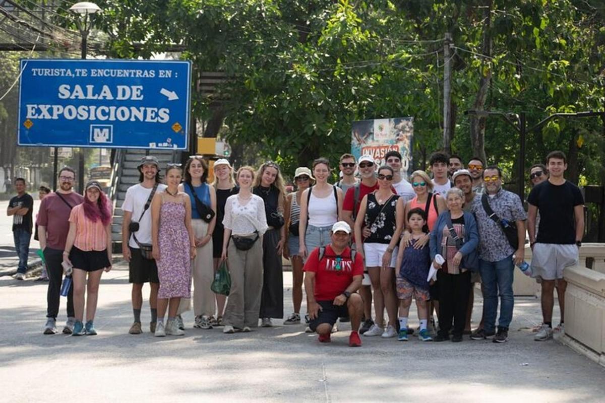 a group of people posing for a picture on a street