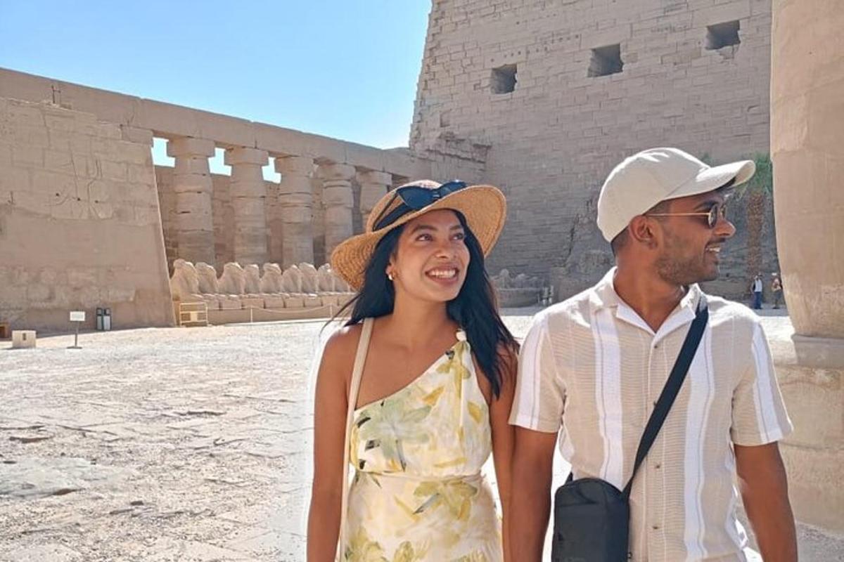 a man and a woman standing in front of a building