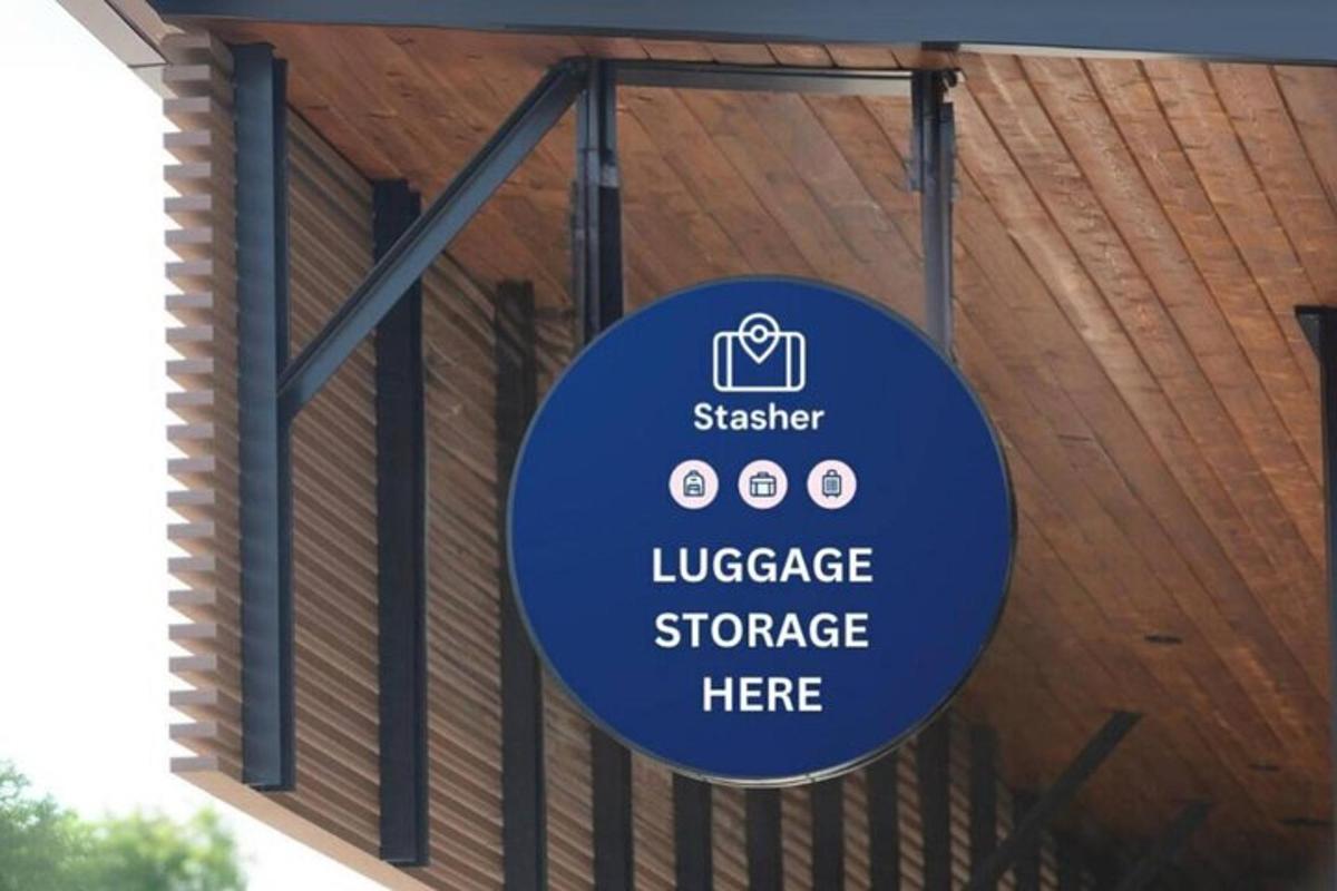 a sign hanging from the side of a building