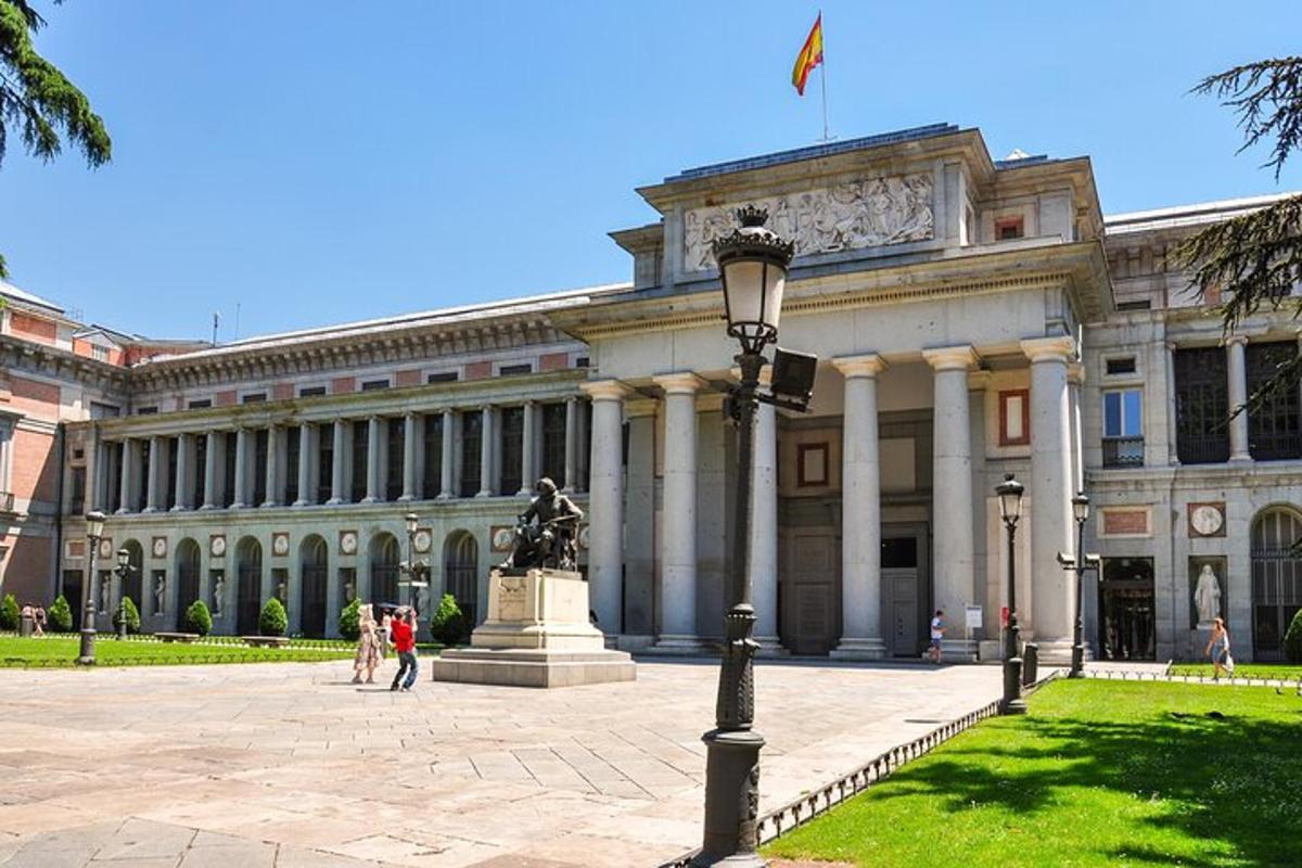 a large building with a statue in front of it
