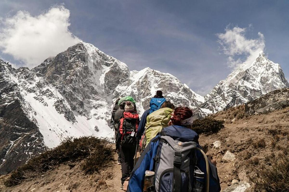 a group of people walking up a mountain
