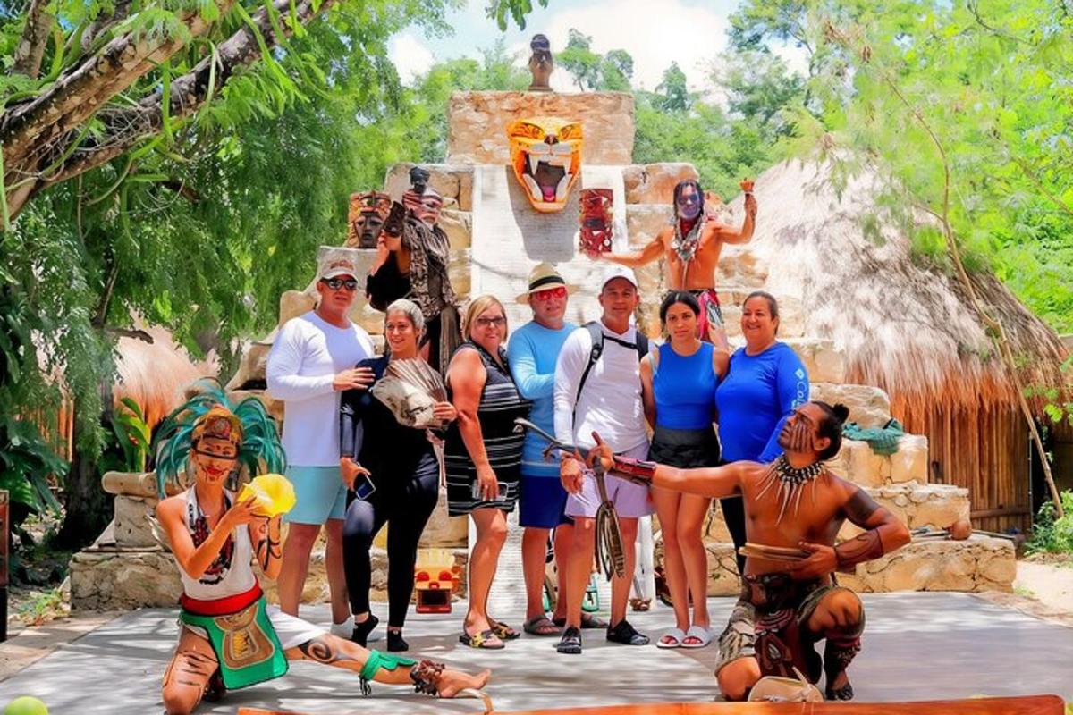 a group of people standing in front of a fountain