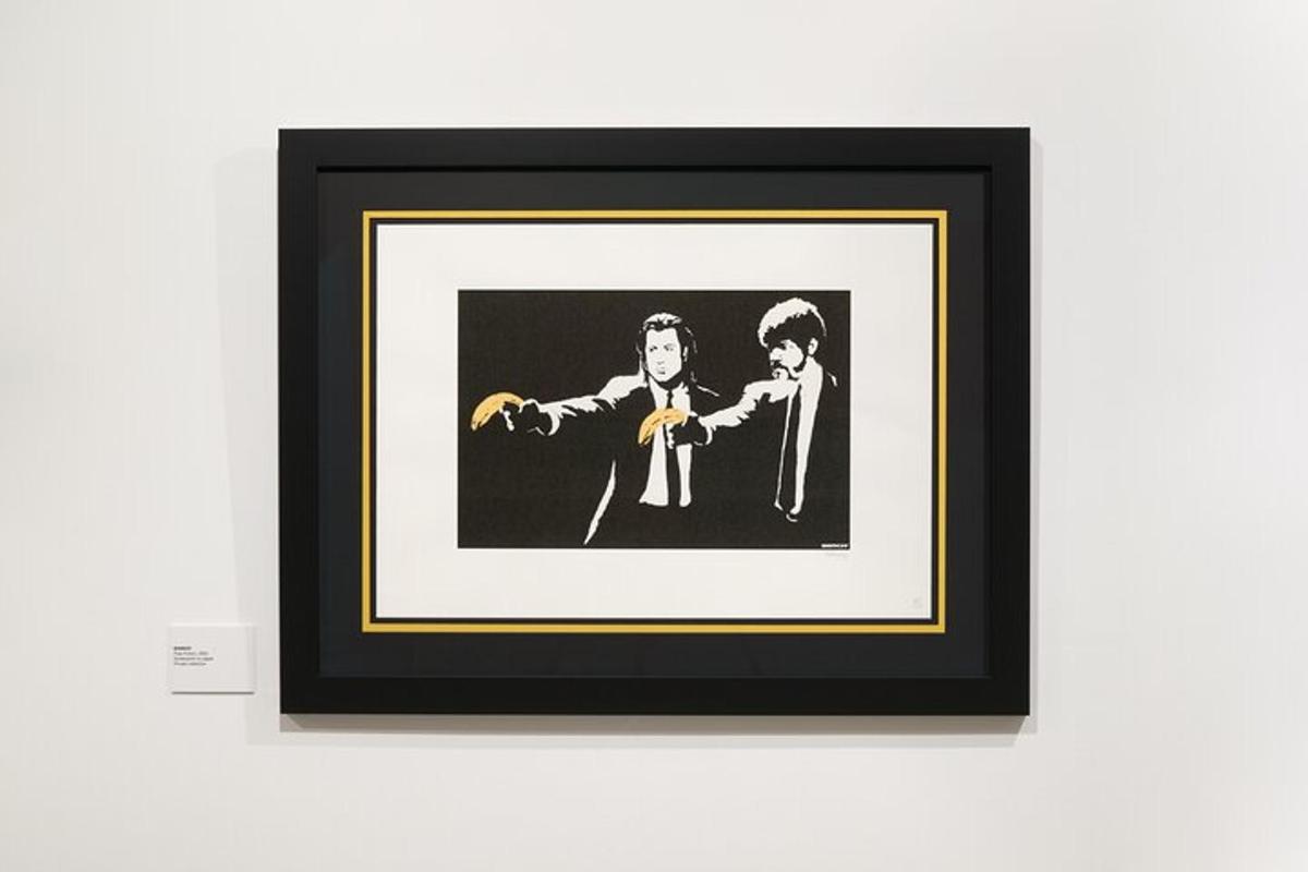 a framed picture of two men in suits