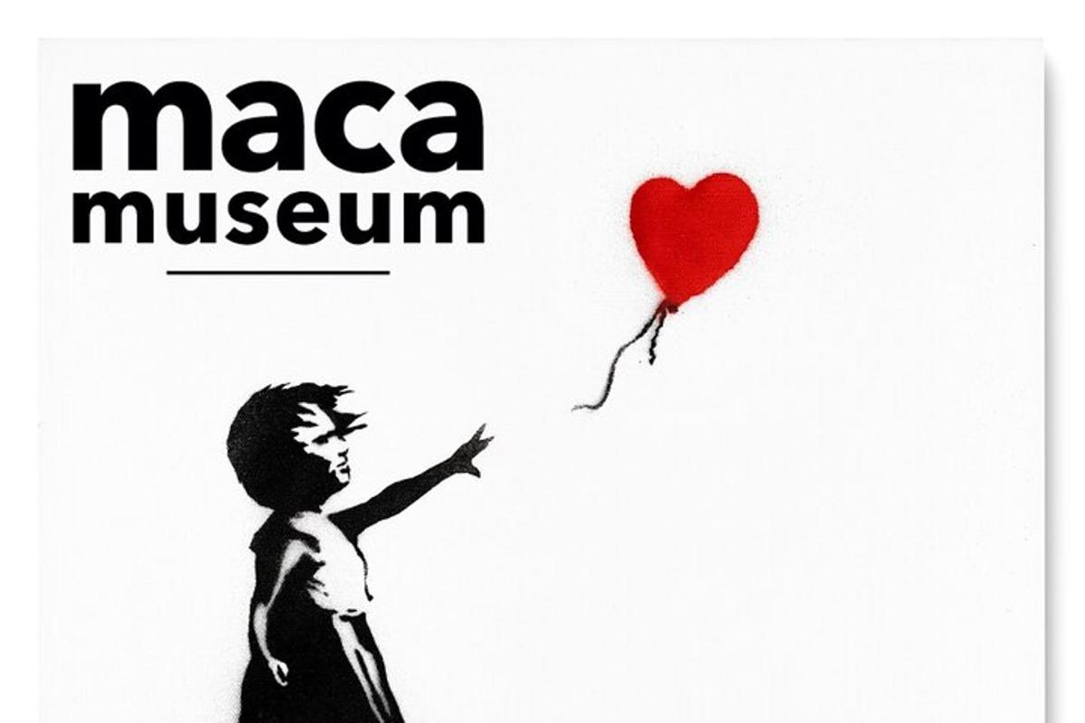a boy holding a red heart balloon with the words maca museum