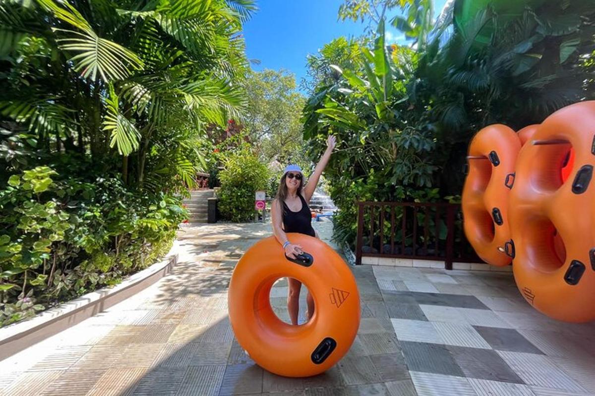 a woman is sitting on a large orange object