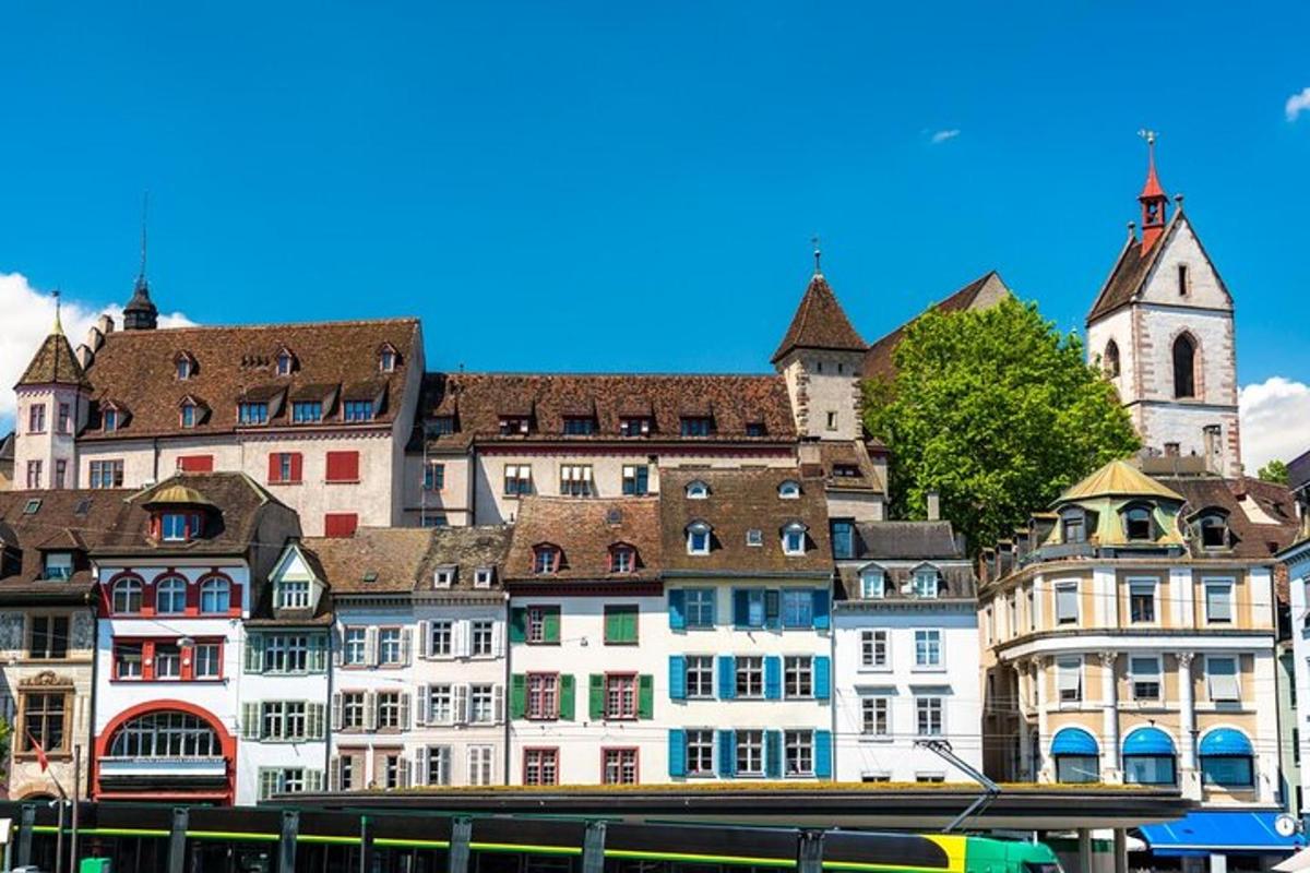 a group of buildings with a church in the background