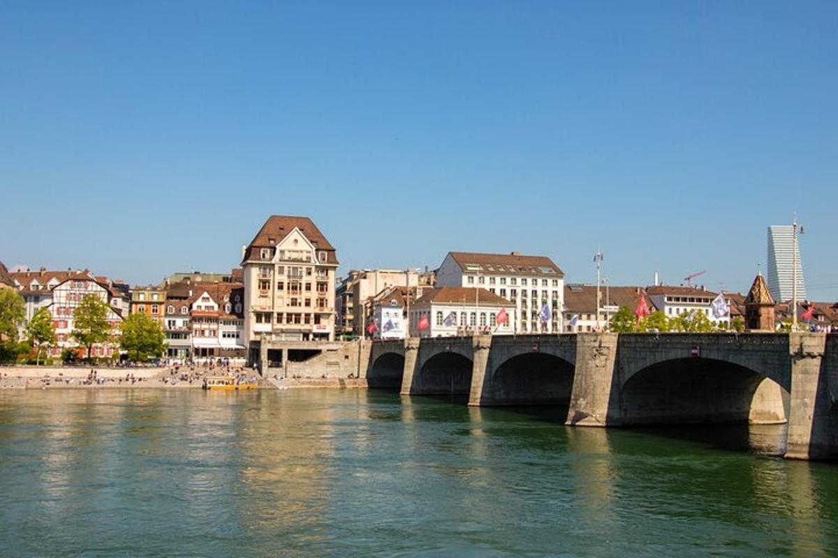a bridge over a river in a city with buildings