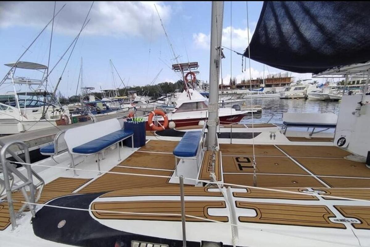 a wooden deck on a boat in a harbor