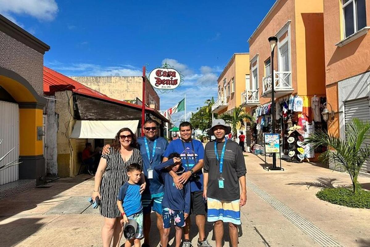 a group of people posing for a picture on a street