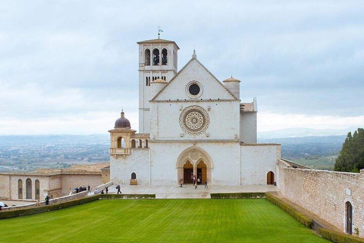 a church with a green lawn in front of it