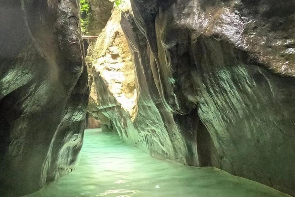 a walkway in a cave with water in it