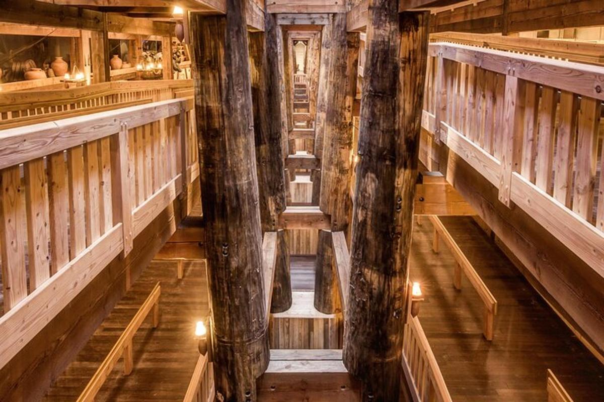 an inside view of a wooden building with columns