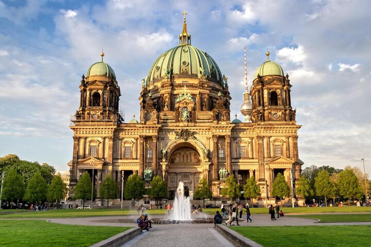 a large building with a fountain in front of it