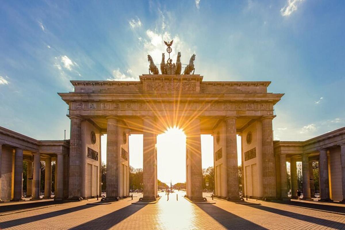 a large neoclassical building with the sun shining