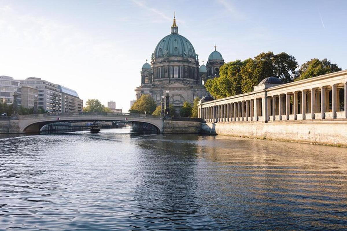 a bridge over a river in front of a building