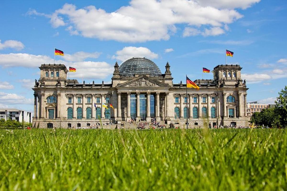 a large building with flags in front of it