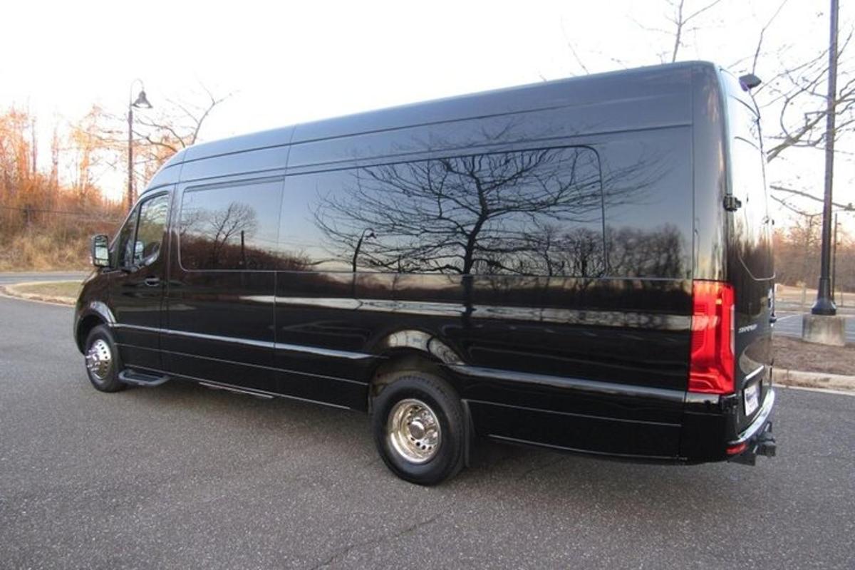 a black van is parked in a parking lot