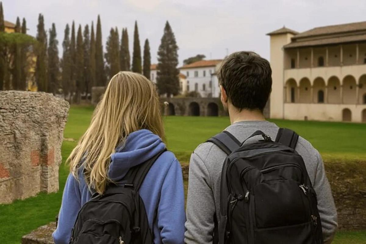 a man and woman with backpacks looking at a building