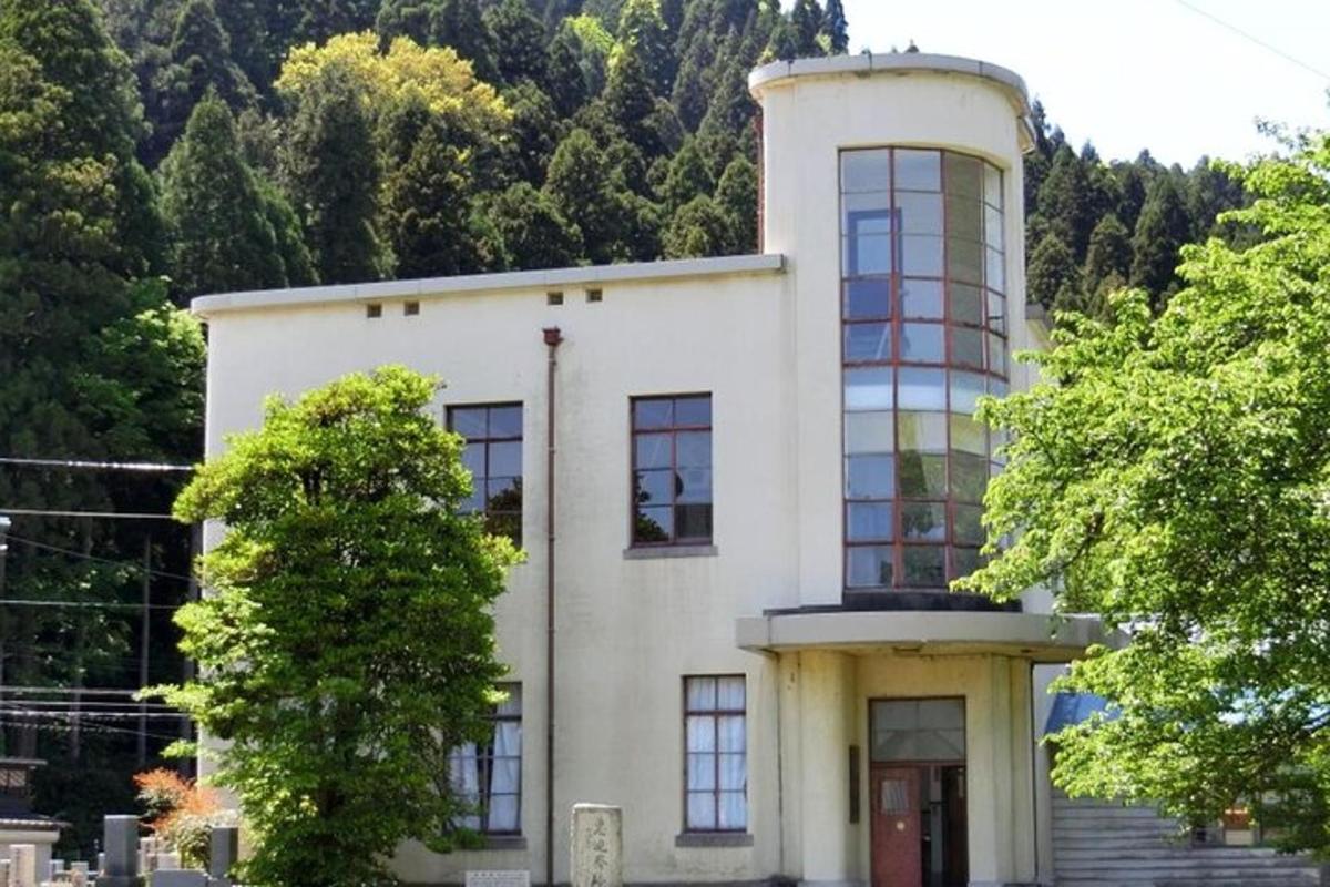 a white building with a tower on top of it