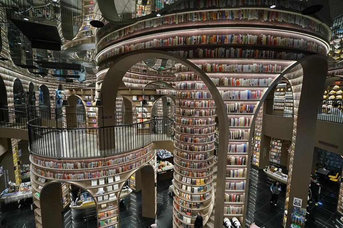 a library filled with books on a wall