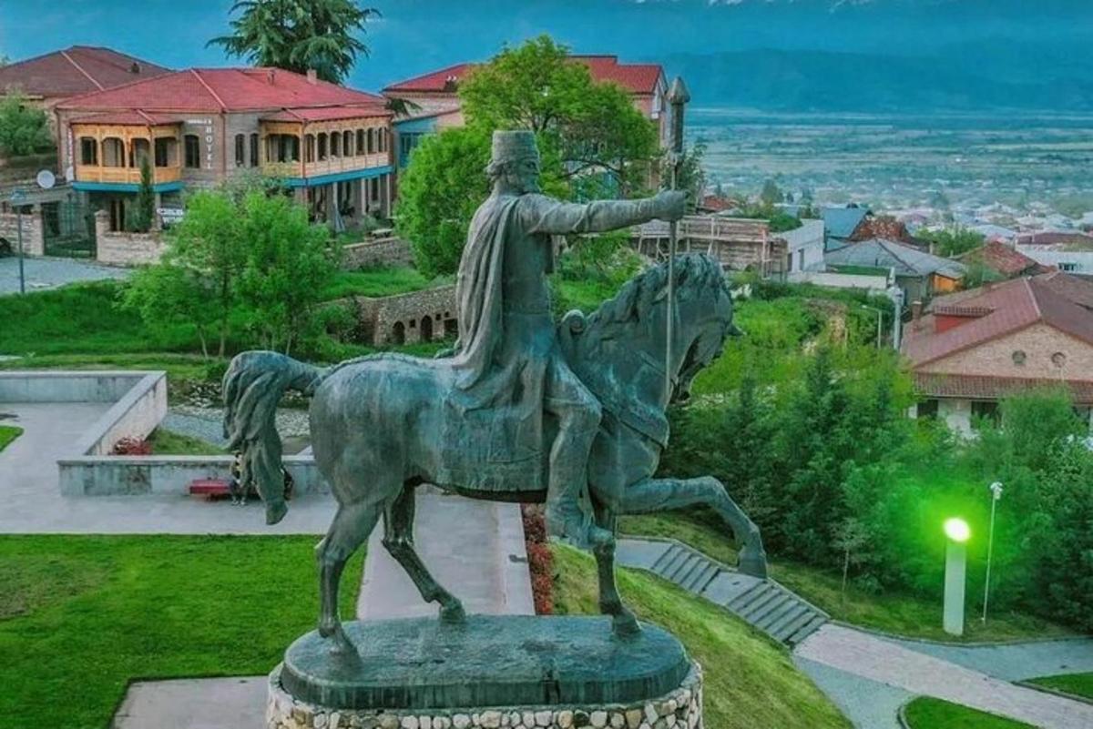 a statue of a man riding a horse