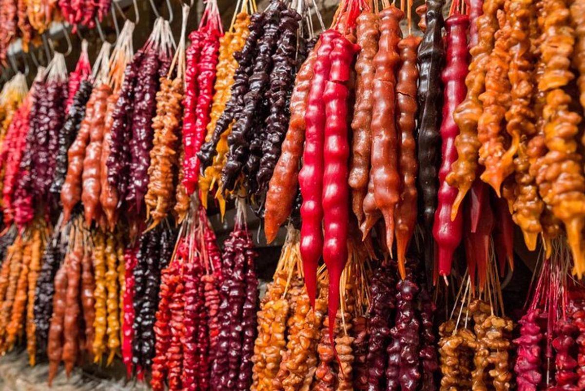 a bunch of different types of vegetables hanging on a wall