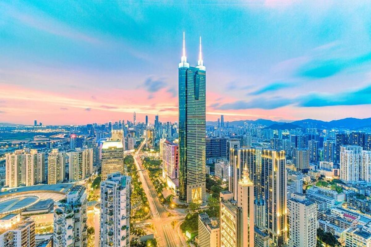a city skyline with a tall skyscraper