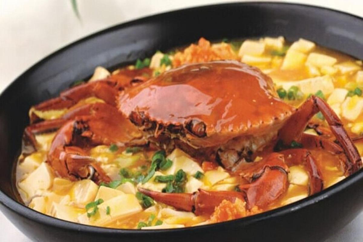 a pan filled with food with meat and vegetables