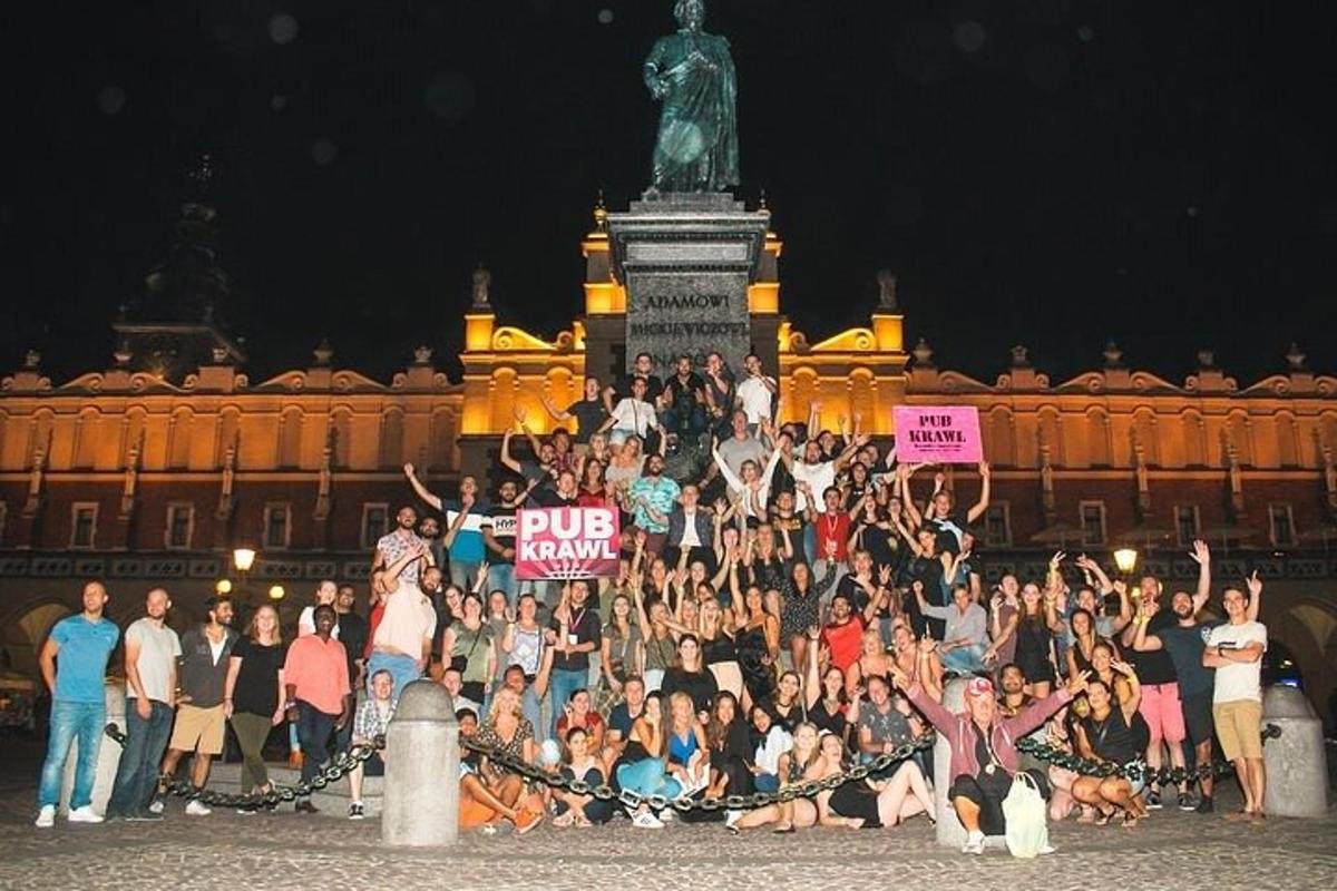 a group of people posing in front of a statue
