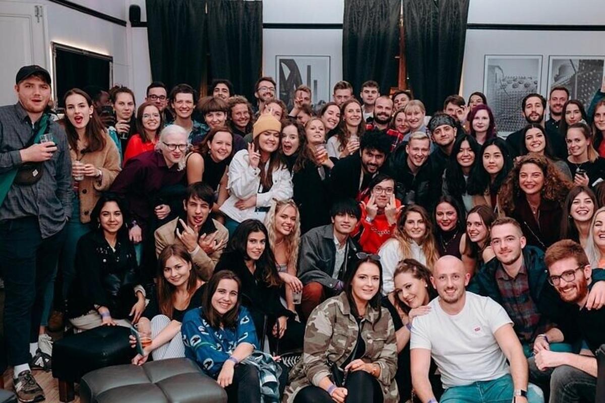 a large group of people posing for a picture