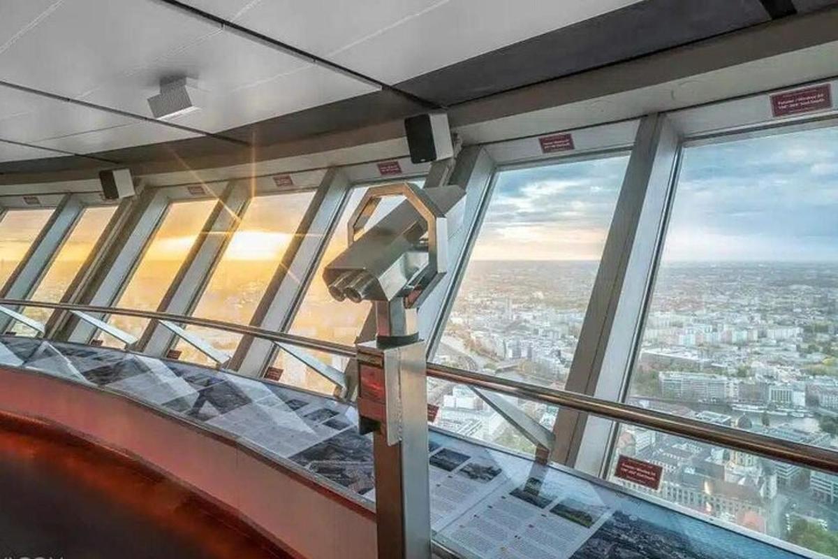 a room with a view of a city from the top of a building