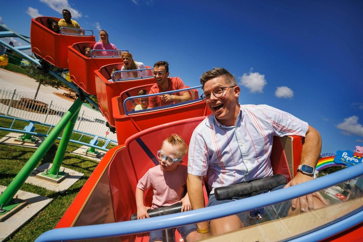 a group of people riding on a roller coaster