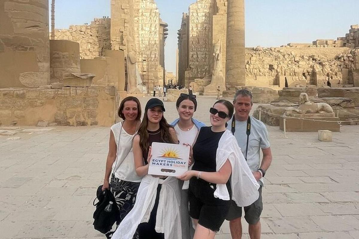 a group of people standing in front of the temple