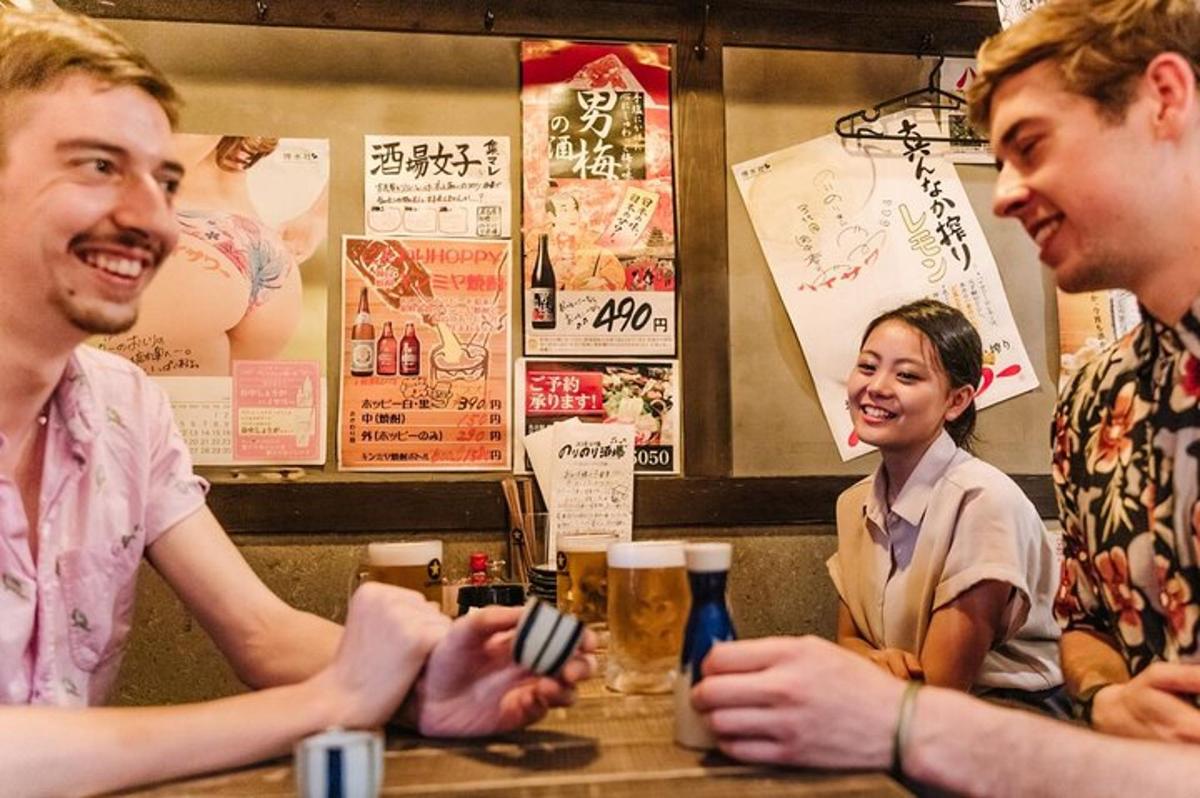 a group of people sitting at a table with beer