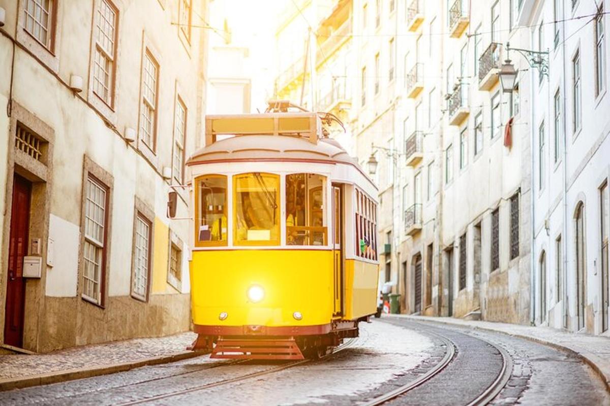 a yellow trolley car driving down a street