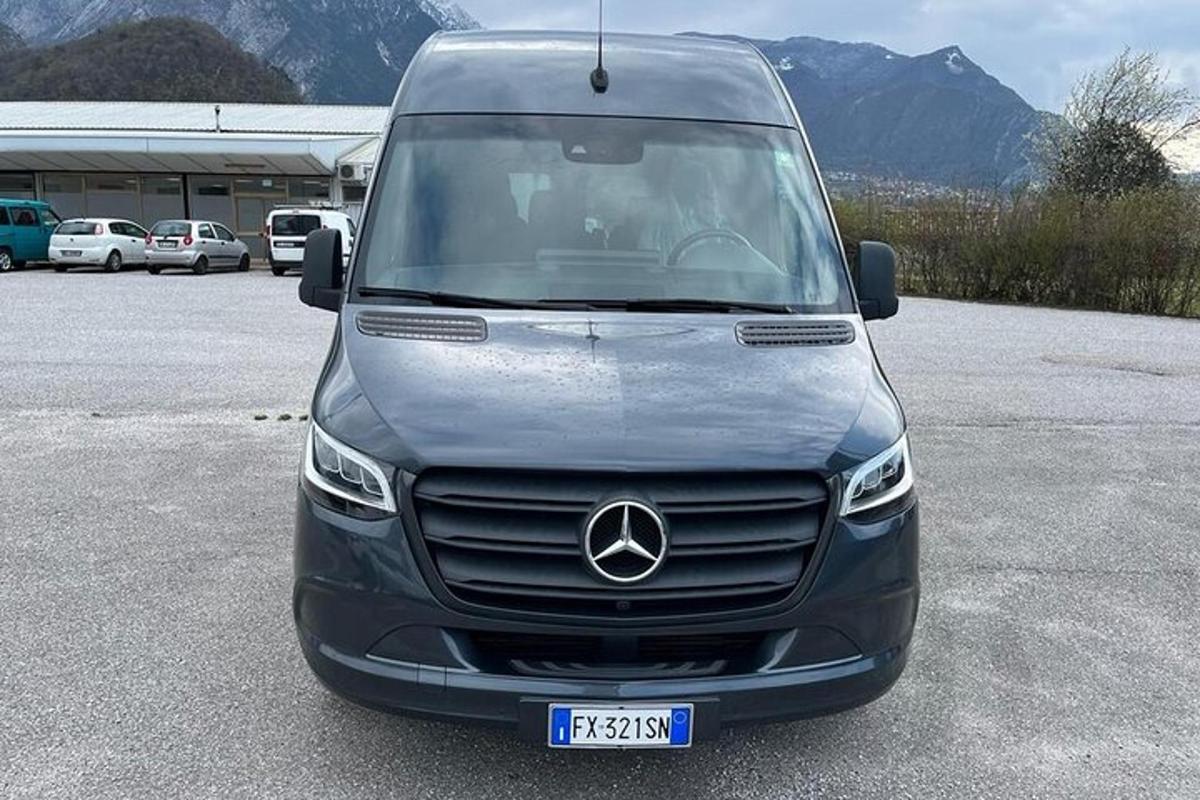 a mercedes benz van parked in a parking lot