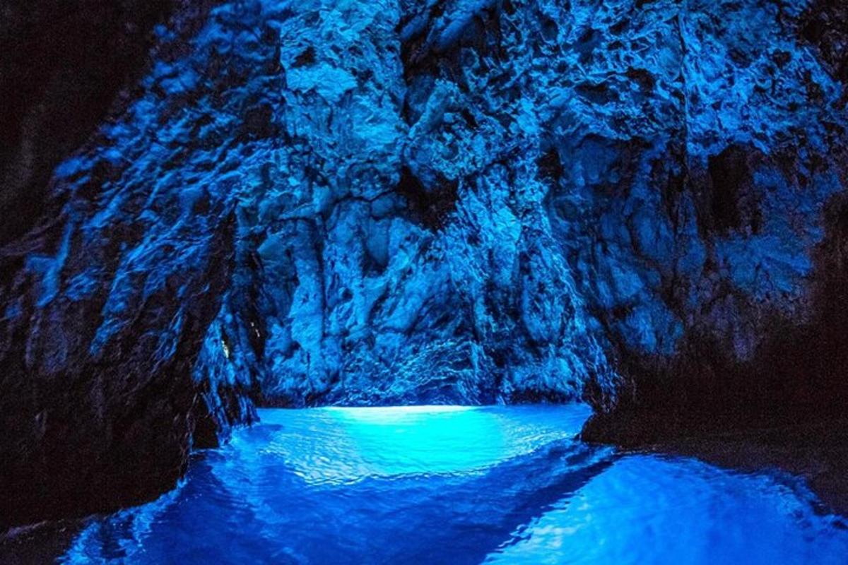 a painting of a river in a cave