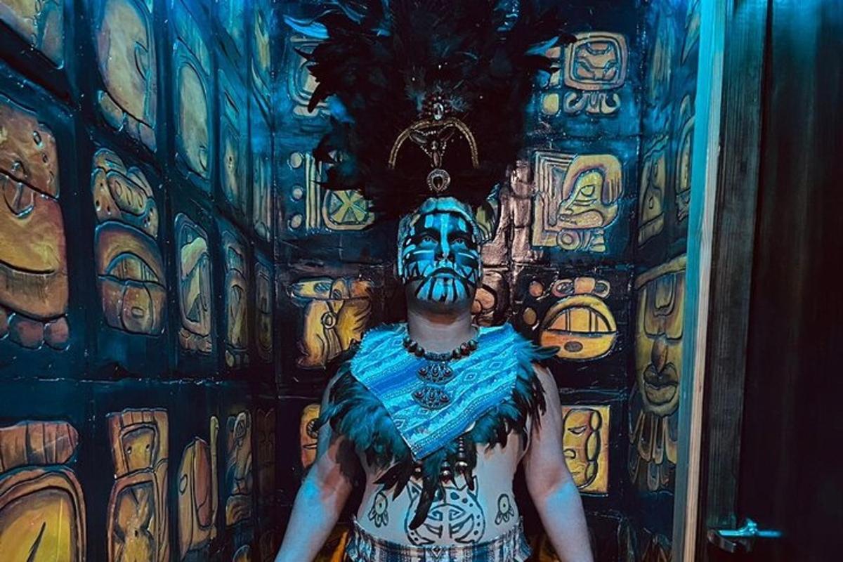 a man with a painted face standing in front of a door