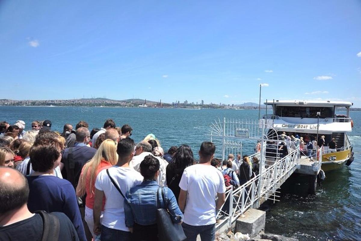 a crowd of people waiting to get on a boat