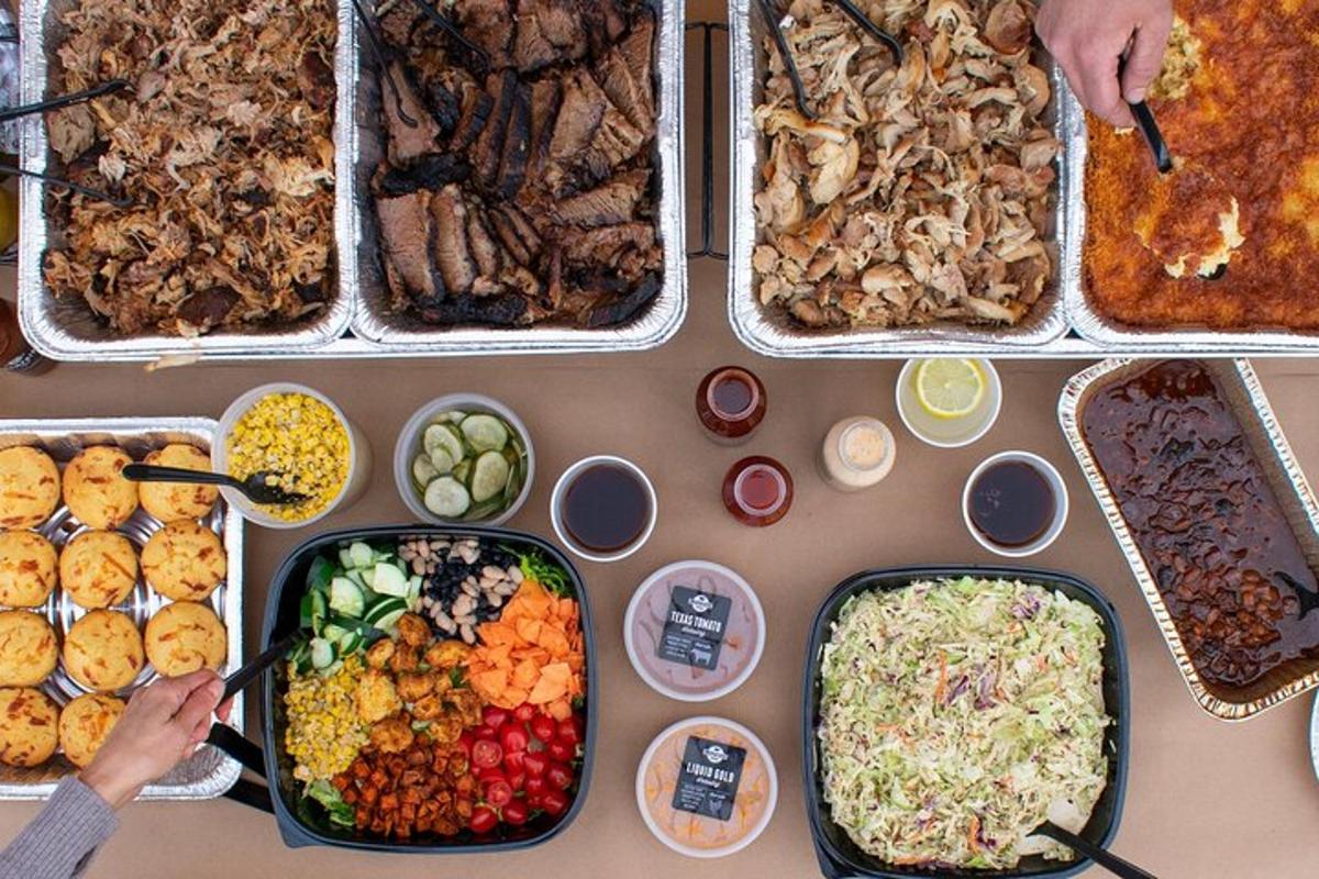 a table topped with trays of different types of food