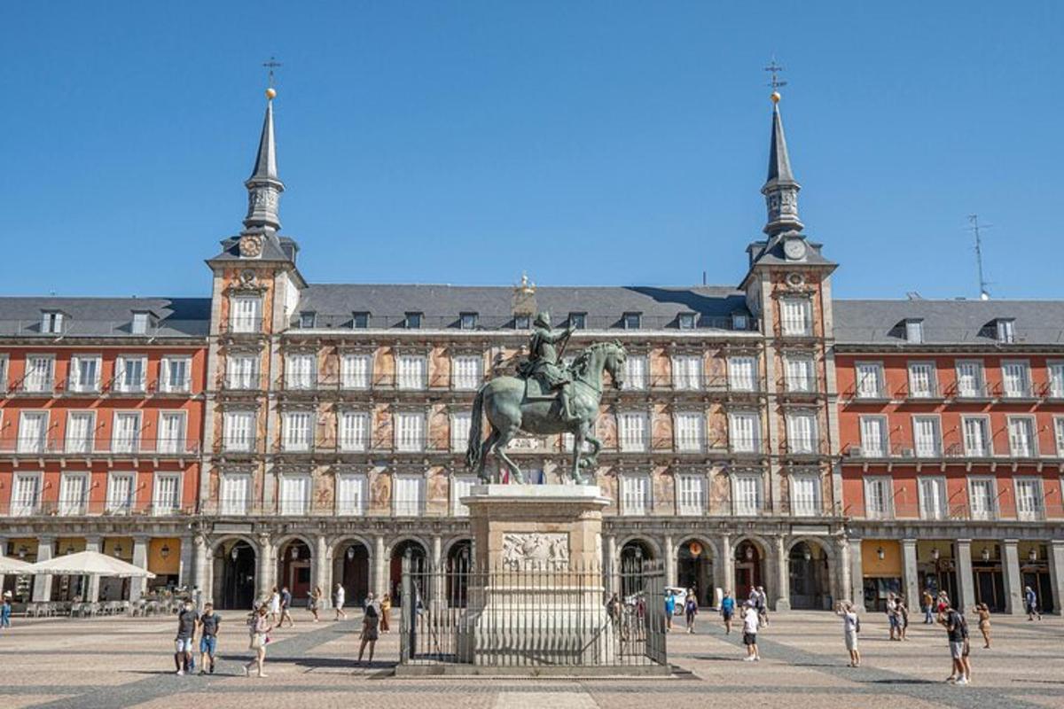a large building with a statue in front of it