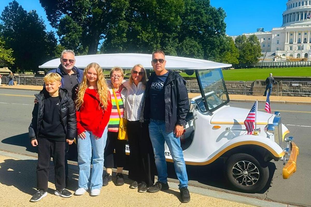 a group of people standing in front of an ice cream truck